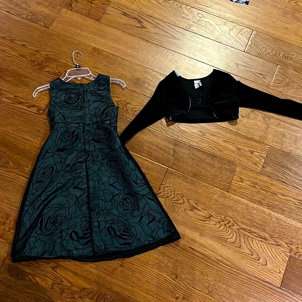 Size 8 dress, black with a design sheet over it,with long sleeve silk coat